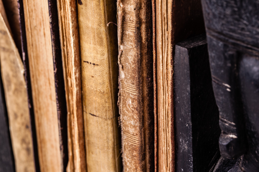 close up shot of some ancient and worn books